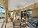 Spacious screened patio with pool view and seating area at 2112 S Chamberlain Blvd, North Port, FL 34286