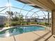 Inviting kidney-shaped pool with screened enclosure at 2112 S Chamberlain Blvd, North Port, FL 34286