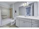 Bathroom with tub, shower, and white vanity at 19556 Petrino St, Venice, FL 34293