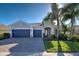 Single-story home with a two-car garage and attractive landscaping at 19556 Petrino St, Venice, FL 34293