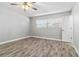 Spacious bedroom with wood-look floors and a window at 6570 Coliseum Blvd, Port Charlotte, FL 33981