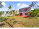 Home with red paver patio and grassy backyard at 11898 Tempest Harbor Loop, Venice, FL 34292