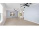 Bright living room with tile floors and ceiling fans at 11898 Tempest Harbor Loop, Venice, FL 34292