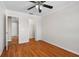 Bedroom with hardwood floors and double-door closet at 11898 Tempest Harbor Loop, Venice, FL 34292