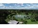 Aerial view of Warm Mineral Springs Park with spring-fed pool and surrounding lush landscaping at 12026 Corsica Ln, North Port, FL 34287