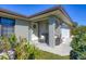 Relaxing front porch with wicker chairs, perfect for enjoying the Florida sunshine at 12026 Corsica Ln, North Port, FL 34287