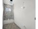 Modern bathroom with hexagonal tile and a new bathtub at 1247 Graham Rd, Venice, FL 34293