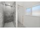 Bathroom with modern grey tile shower and window at 1247 Graham Rd, Venice, FL 34293