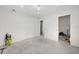Unfinished bedroom with concrete floors and lots of natural light at 1247 Graham Rd, Venice, FL 34293