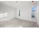 Spacious bedroom with large windows and concrete floors at 1247 Graham Rd, Venice, FL 34293