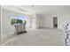 Unfinished living area with concrete floors and ample natural light at 1247 Graham Rd, Venice, FL 34293