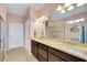 Double vanity bathroom with granite countertop and large shower at 13339 Pacchio St, Venice, FL 34293