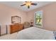 Relaxing bedroom with a comfortable bed and plenty of natural light at 13339 Pacchio St, Venice, FL 34293