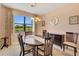 Formal dining room with table, chairs and view of backyard at 13339 Pacchio St, Venice, FL 34293