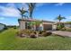 Single story home with a 2-car garage and lush landscaping at 13339 Pacchio St, Venice, FL 34293