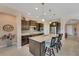 Island kitchen with granite countertops and stainless steel appliances at 13339 Pacchio St, Venice, FL 34293