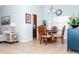 Dining area featuring a decorative table and chairs, tile floors, chandelier, and lots of light at 172 Southampton Pl # 346, Venice, FL 34293