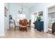Dining area features a leaf-patterned wood table set and a charming navy blue cabinet at 172 Southampton Pl # 346, Venice, FL 34293