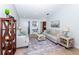 Living room with tile floors, light walls, neutral sofas, accent tables and eclectic decor at 172 Southampton Pl # 346, Venice, FL 34293