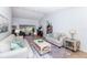 Bright living room features vaulted ceiling, neutral paint, tile floors and a large window at 172 Southampton Pl # 346, Venice, FL 34293
