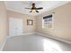 Well-lit bedroom featuring tile floors and a ceiling fan at 192 Grand Oak Cir, Venice, FL 34292