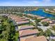 Aerial view of a community by a lake, highlighting the neighborhood's waterfront location at 19256 Lappacio St, Venice, FL 34293