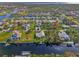 Aerial view highlighting a neighborhood's waterfront location and homes at 4646 Fallon Cir, Port Charlotte, FL 33948
