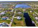 Aerial view of waterfront homes and properties with lush landscaping at 4646 Fallon Cir, Port Charlotte, FL 33948