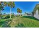 Screened patio and grassy backyard overlooking the canal at 4646 Fallon Cir, Port Charlotte, FL 33948