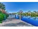 Long wooden dock stretching out over the calm water at 4646 Fallon Cir, Port Charlotte, FL 33948
