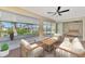 Relaxing screened patio overlooking the water with seating area at 4646 Fallon Cir, Port Charlotte, FL 33948