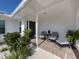 Inviting front porch with seating area, perfect for relaxing at 514 Palm Ave, Nokomis, FL 34275