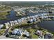 Bird's eye view of waterfront homes and community at 737 Shakett Creek Dr, Nokomis, FL 34275