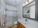 Modern bathroom with a walk-in shower and updated vanity at 737 Shakett Creek Dr, Nokomis, FL 34275