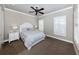 Charming bedroom with carpeted floors and a plush queen bed at 737 Shakett Creek Dr, Nokomis, FL 34275
