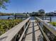Private wooden dock with boat lift at 737 Shakett Creek Dr, Nokomis, FL 34275