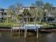 Private boat dock with covered slip and lift at 737 Shakett Creek Dr, Nokomis, FL 34275