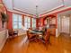 Elegant dining room with hardwood floors, a built-in bar, and a chandelier at 737 Shakett Creek Dr, Nokomis, FL 34275