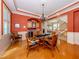 Bright dining room with hardwood floors and a built-in bar at 737 Shakett Creek Dr, Nokomis, FL 34275