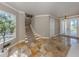 Bright entryway with tile floors and staircase at 737 Shakett Creek Dr, Nokomis, FL 34275