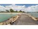 Stone jetty path leading to beach at 737 Shakett Creek Dr, Nokomis, FL 34275