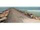Pathway on a stone jetty by the ocean at 737 Shakett Creek Dr, Nokomis, FL 34275