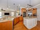 Spacious kitchen with granite island, stainless steel appliances, and hardwood floors at 737 Shakett Creek Dr, Nokomis, FL 34275