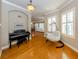 Living room with piano and hardwood floors at 737 Shakett Creek Dr, Nokomis, FL 34275