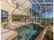 Enjoy the refreshing pool and spa, surrounded by a screened enclosure at 737 Shakett Creek Dr, Nokomis, FL 34275