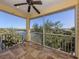 Enjoy water views from this screened balcony, complete with tile flooring and ceiling fan at 737 Shakett Creek Dr, Nokomis, FL 34275