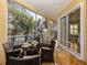 Relaxing screened balcony with outdoor seating and scenic water views at 737 Shakett Creek Dr, Nokomis, FL 34275