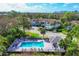 Aerial view showcasing the community pool, clubhouse, and surrounding residences at 804 Montrose Dr # 103, Venice, FL 34293