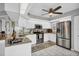 Modern kitchen featuring stainless steel appliances, granite countertops, and ample cabinet space at 804 Montrose Dr # 103, Venice, FL 34293