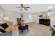 Warm and inviting living room featuring luxury vinyl plank flooring and ample space at 804 Montrose Dr # 103, Venice, FL 34293